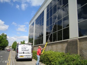 Clean and bright windows cleaning a high windows on a commercial Bath property